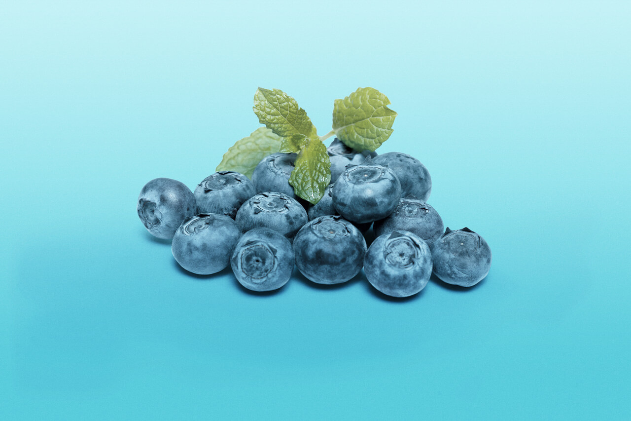 Blueberries on blue background